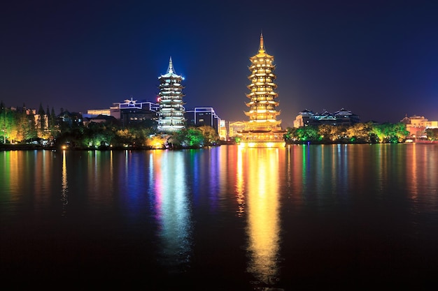 Golden and silver pagodas in banyan lake at nightguilinChina