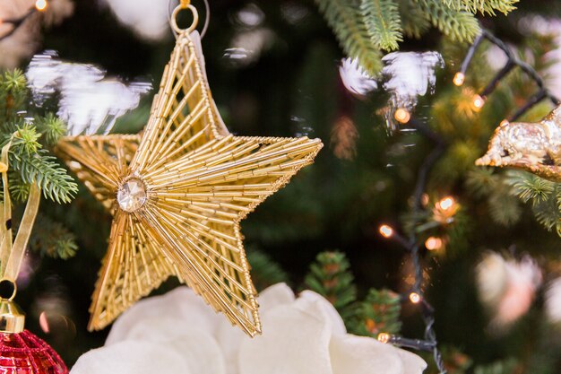 Golden star on christmas tree. New year decorations