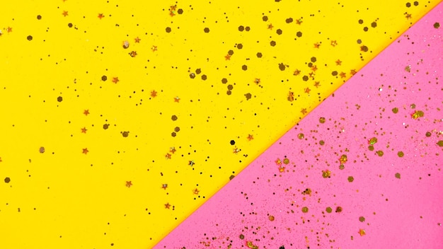 Фото Золотая звезда окропляет желтый и розовый фон