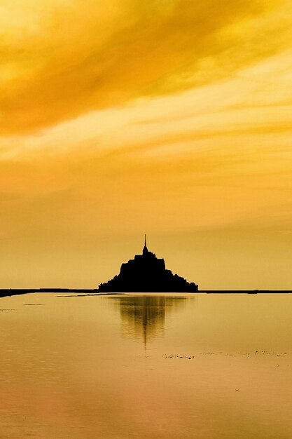 Golden sunrise on mount st michael normandy