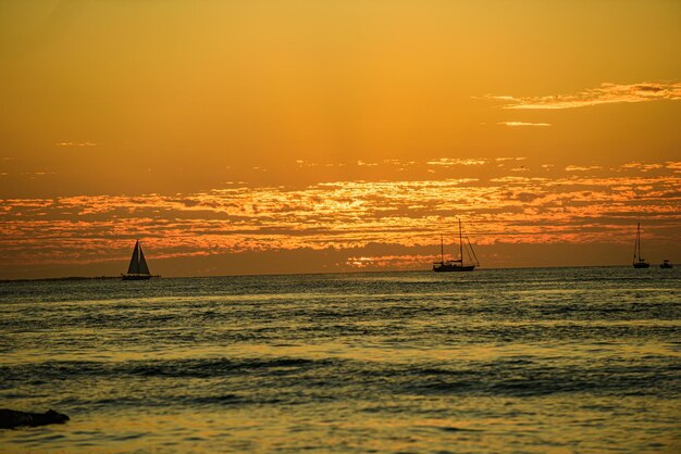 Golden sunrise sunset over the sea waves Sunrise over the ocean