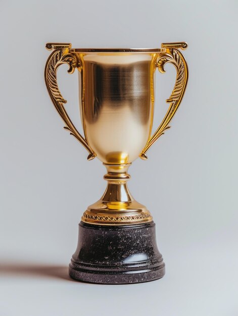 Golden trophy winner cup on a light background