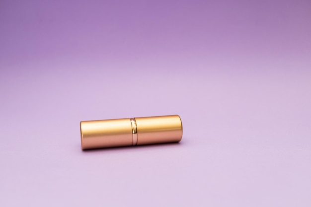 Golden tube on purple background