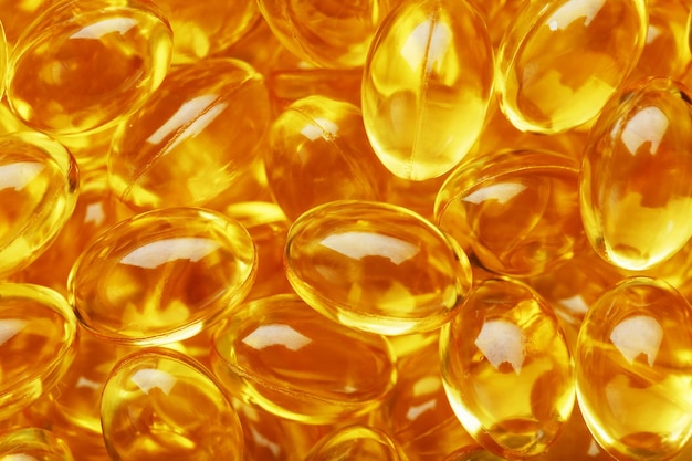 Golden Vitamine D3 Capsules close-up in volledig schermDe belangrijkste vitamine in een licht verteerbare vloeibare vorm