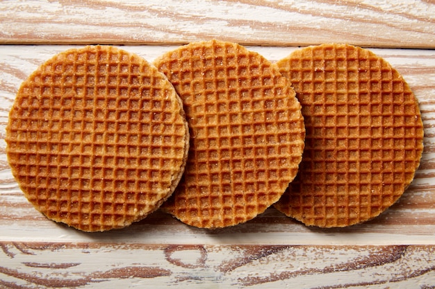 Golden waffle wafer biscuits in a row