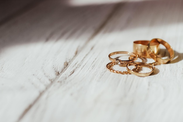 Golden wedding rings on the background of wooden figured boards