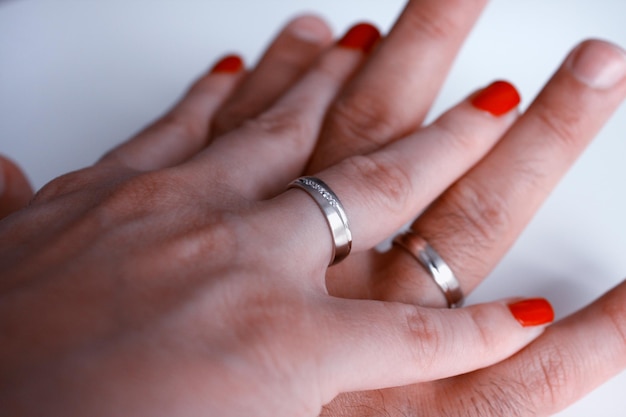 Golden wedding rings and couple hands