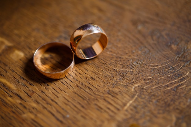 Golden wedding rings for newlyweds on their wedding day