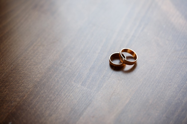 Golden wedding rings for newlyweds on their wedding day