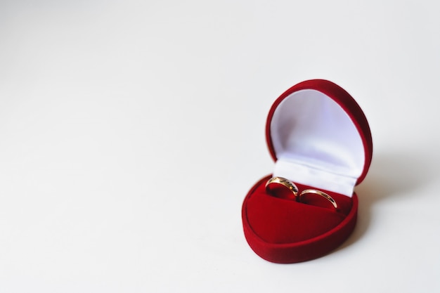 Golden wedding rings in red box 