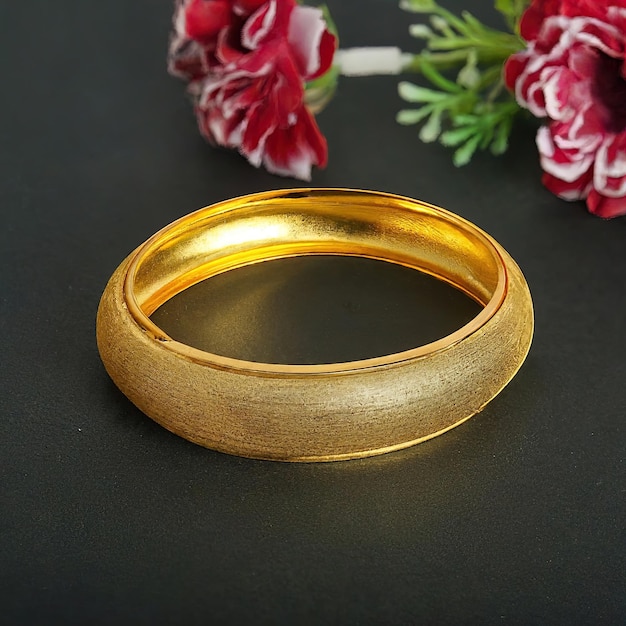 木製のテーブルの上にある金の結婚指輪