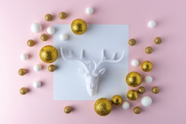 Golden and white glitter balls with white reindeer