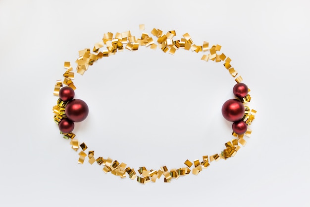 Golden wreath with three red balls