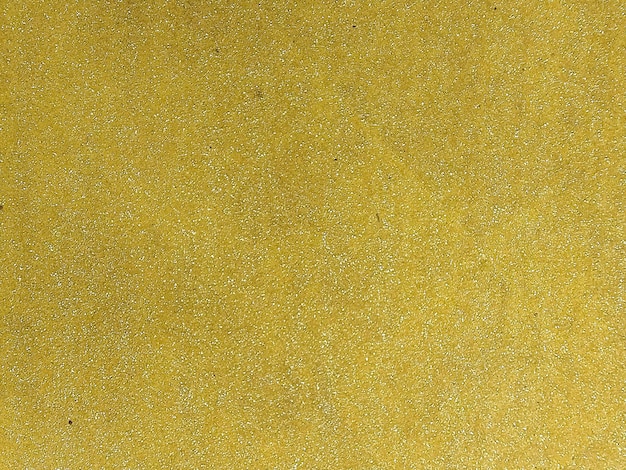 Foto fondo ruvido giallo dorato con piccoli puntini bianchi