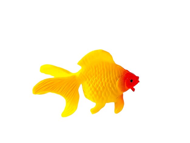 Photo a goldenfish toy is on a white background