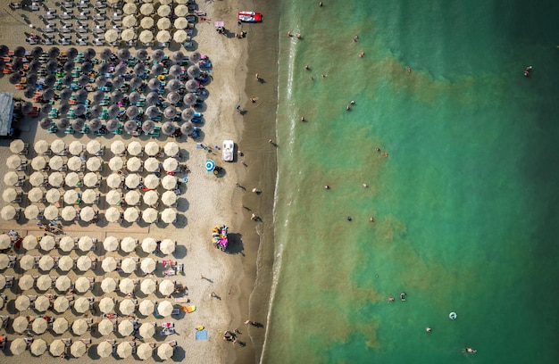 Golem durres albania aerial view to sandy beach full of umbrellas and people in summer season