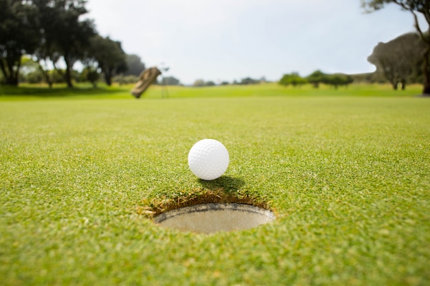 Golf ball at the edge of the hole 