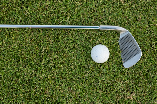 Golf Ball and Golf Club on grass