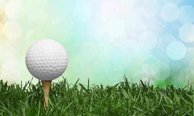 Photo golf ball in grass background. sport and recreation concept