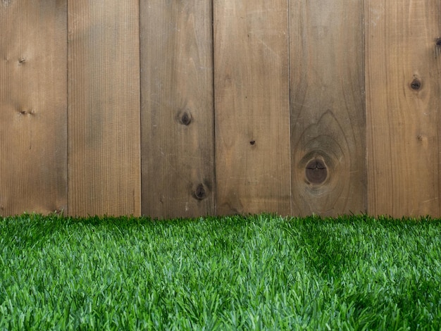 Golf and ball on green grass and wood background