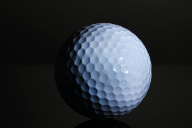 Photo golf ball on grey background