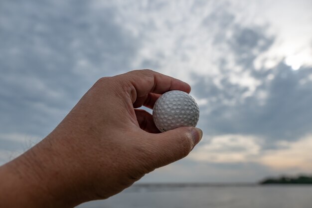 Golf ball in hand