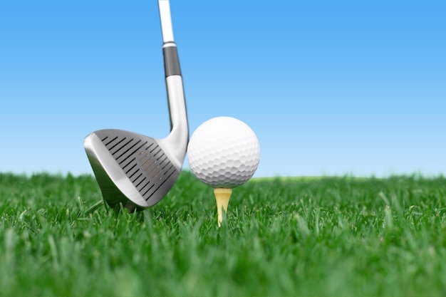 Golf ball on tee isolated on background