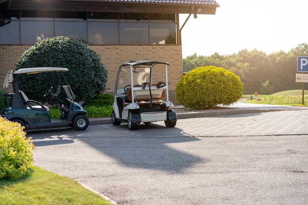 Golf car standing parking golf club Warm summer day Luxury lifestyle concept