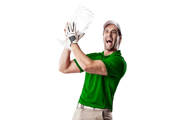 Golf Player in a green shirt celebrating with a glass trophy in his hands, on a white Background.