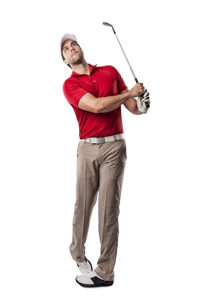 Photo golf player in a red shirt taking a swing, on a white space.