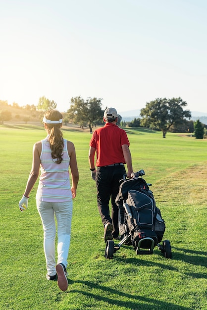 Golfer and Caddie playing golf. Golf Concept.