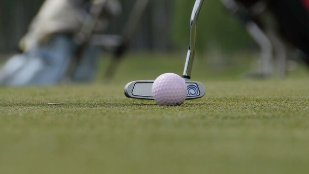 Golfer hitting golf shot with club on the course hit the ball golf