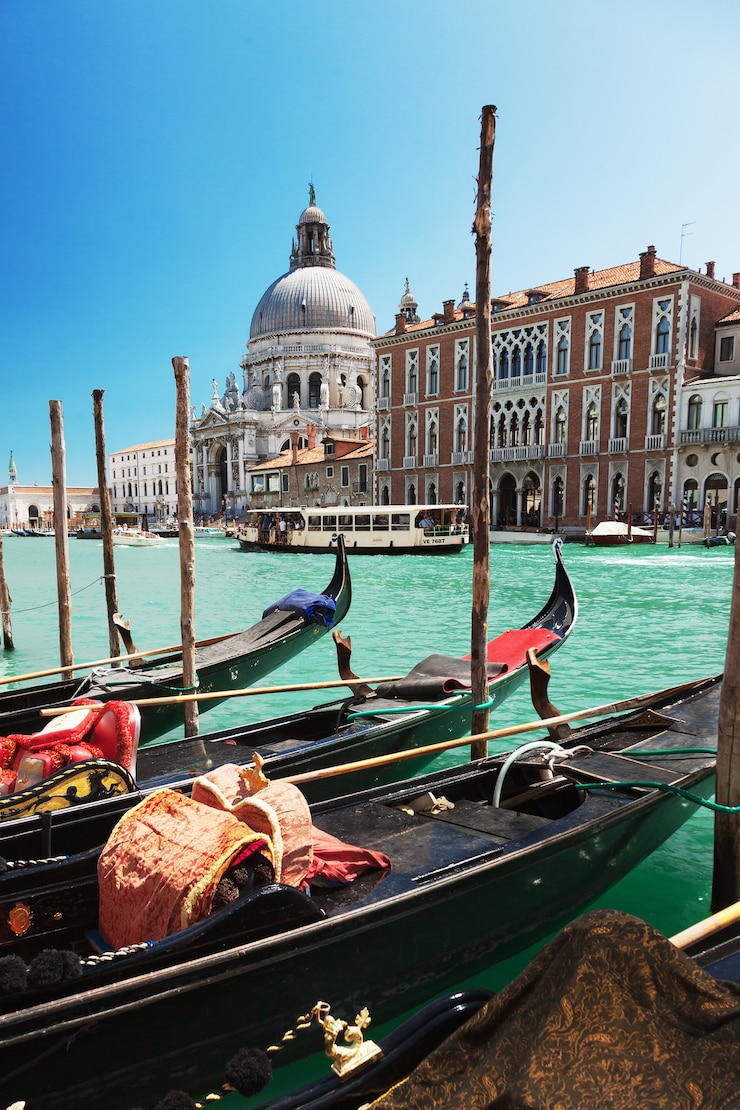 Gondolas in Grand Canal in Venice, Italy, with Basilica di Santa Maria della Salute in the background