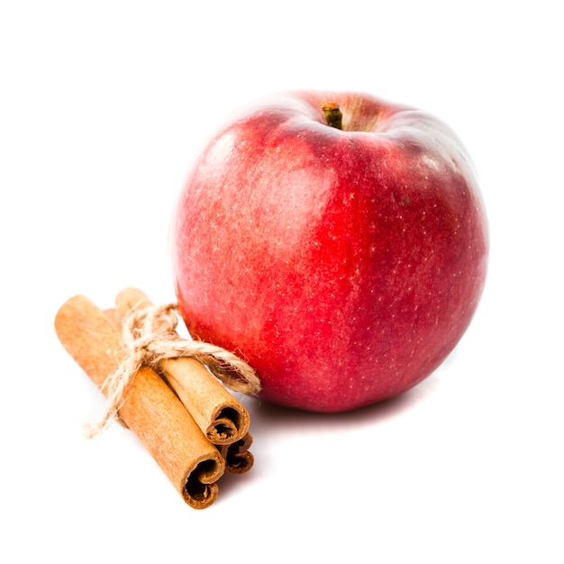 Good combination of apple and cinnamon isolated on white