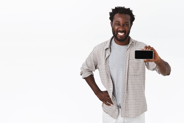 Good-looking african-american bearded man in casual outfit