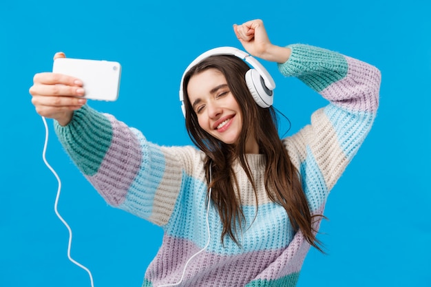 Good-looking female in sweater showing gesture.