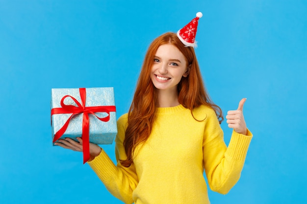 Good-looking redhead female in yellow sweater