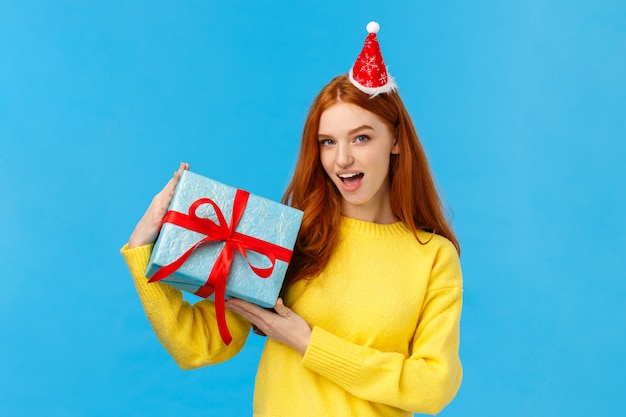 Good-looking redhead female in yellow sweater