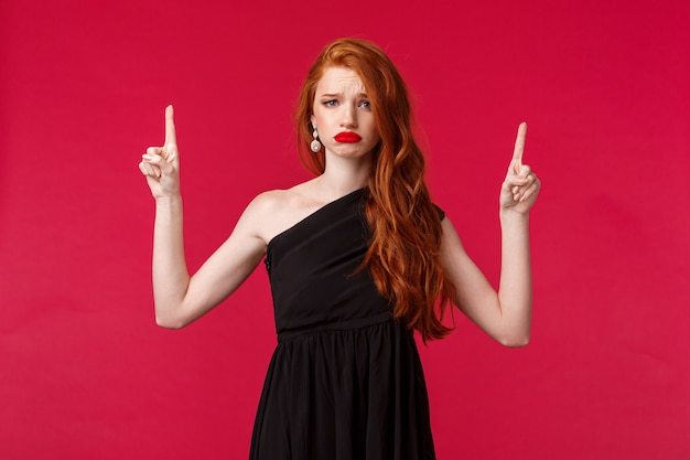 Good-looking redhead woman with lipstick