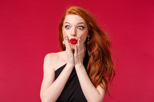 Good-looking redhead woman with lipstick