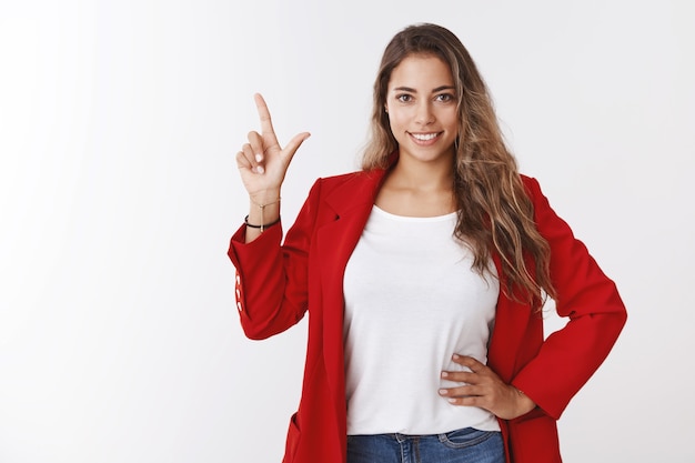 Good-looking stylish modern businesswoman giving lecture how get top, telling business lifehacks pointing up holding hand waist smiling self-assured, looking confident. Successful female concept