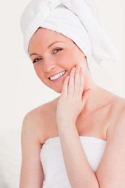 Good looking young woman wearing towel