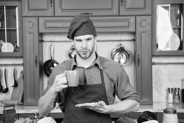 Photo good morning barista man in coffee shop handsome barista with morning coffee at bakers shop for lovers of coffee