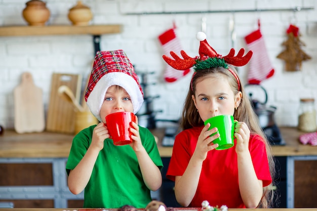 Good morning. Brother and sister drink tea at the kitchen table with cookies in the kitchen. A time of miracles and fulfillment of desires.