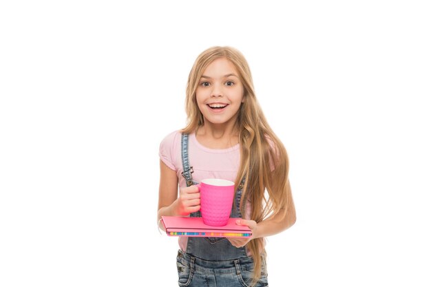 Good morning Delicious drink recipe Small child holding cup with warm milk drink Little girl enjoying hot drink Cute kid taking a drink of tea with milk morning cup of tea happy and healthy