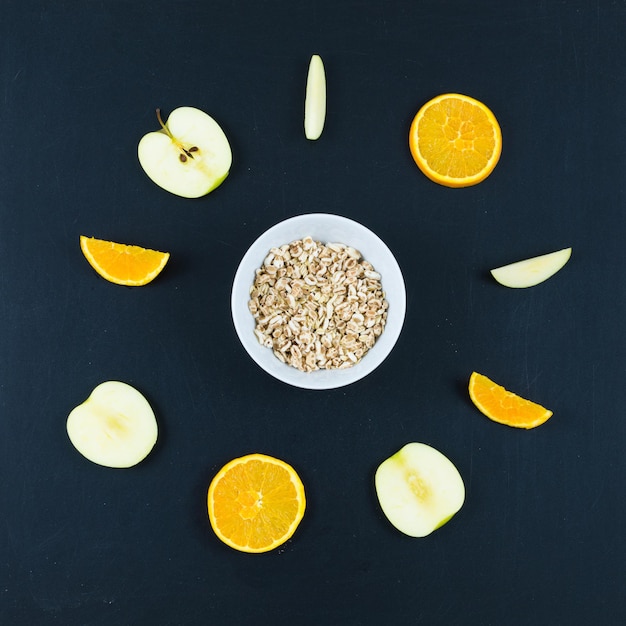 Good morning with healthy breakfast with composition flat lay of sliced apple and orange oats