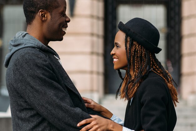 Good news for African American. Happy couple. Stylish young people, gentle cuddle, atmospheric moment, happiness and successful date concept