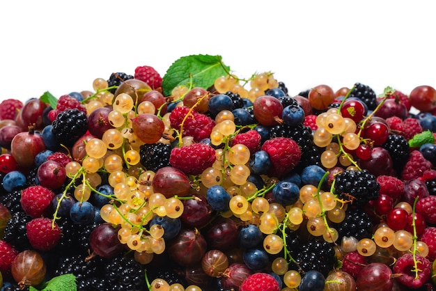 Gooseberries, blueberries, mulberry, raspberries, white and red currants isolated on white background.