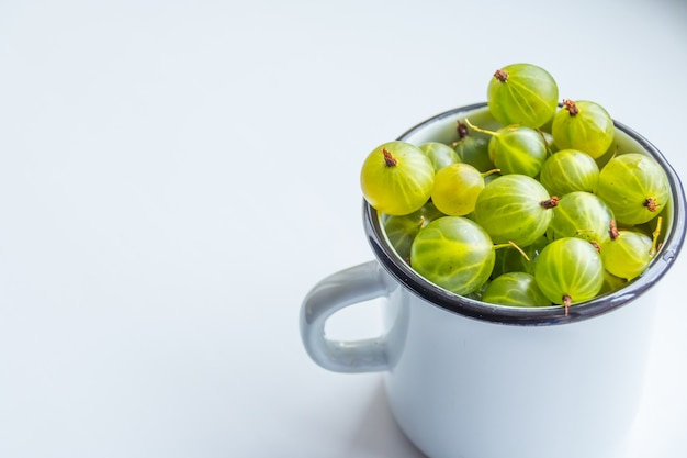 Gooseberries in white cup