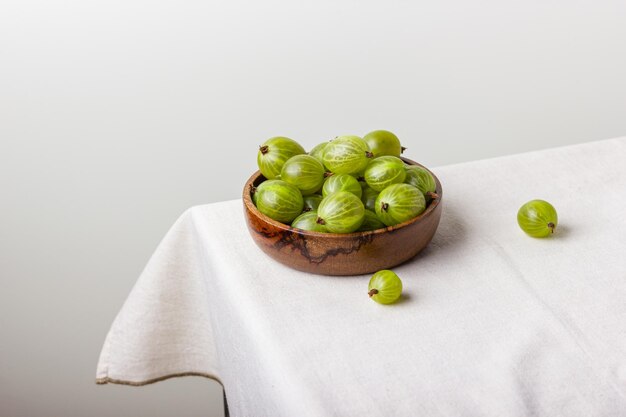 Gooseberry in a wooden bowl